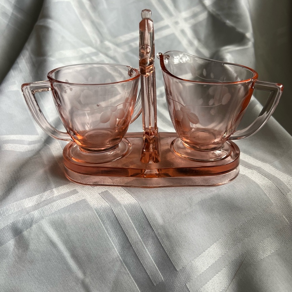 Pink depression, glass creamer, and sugar bowl